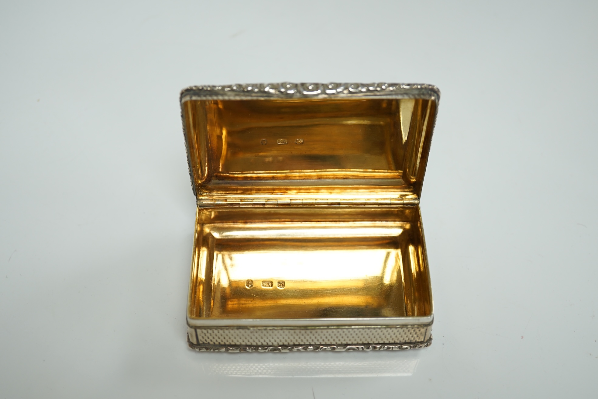A George IV silver rectangular table snuff box, by Edward Stammers, Birmingham, 1827, 86mm, weight 159 grams. Condition - good.